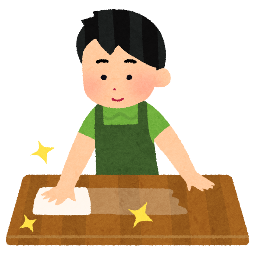 ふきんを使ってテーブルを拭く人の画像